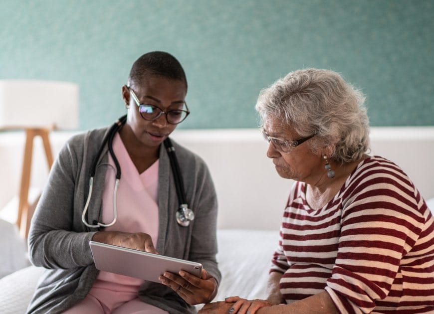 Doctor talking to a senior woman